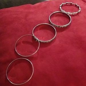 Set of five silver costume jewelry bracelets
